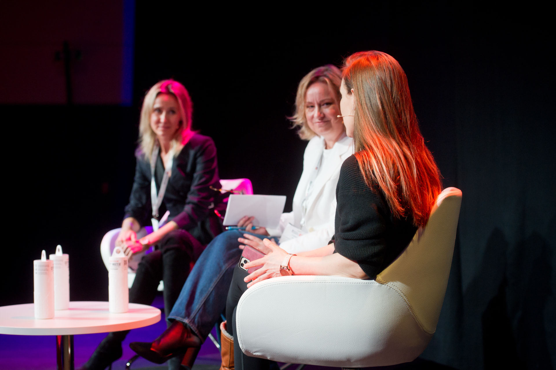 Jos Dirkx speaking with two women on a World Summit AI panel